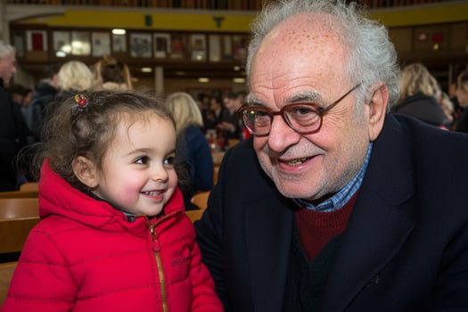 An older man and a little girl sitting together photo