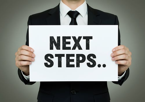 business person holding next steps sign business decision concept photo