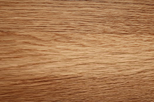 A Natural Textured Surface of Golden Brown Wood Grain Pattern Displaying Fine Details and Organic Lines Creating a Warm and Rustic Feel photo