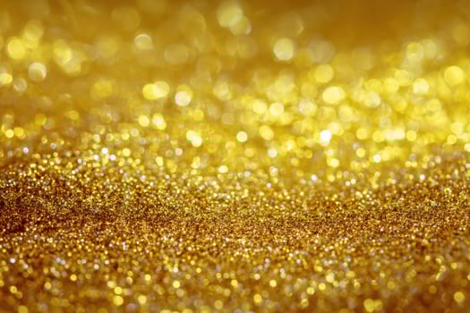 Golden Abstract Background Texture Sparkles and Glitter Shimmer Beautiful Blur Defocused Lights Luxurious and Magical Holiday Wallpaper Glowing photo