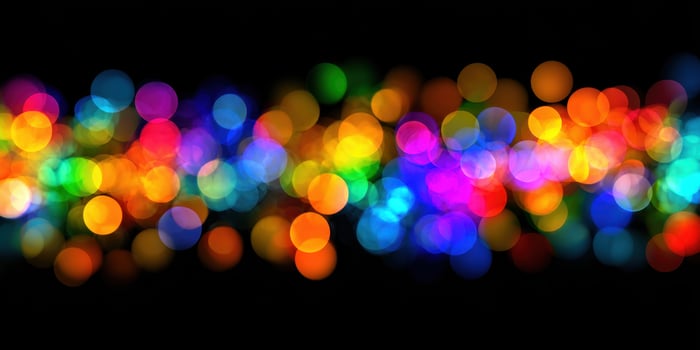 Colorful lights are shown on a black background photo