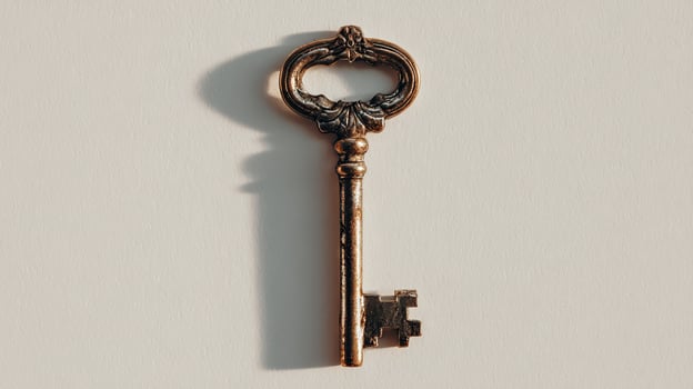 Minimalistic Key Hanging on White Wall - Stock Photo