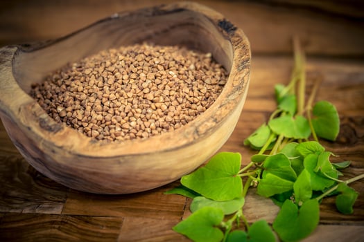 Fagopyrum esculentum buckwheat on olivewood photo