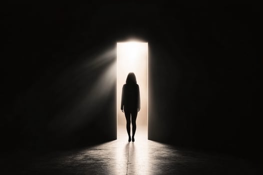 A woman standing in front of an open door photo
