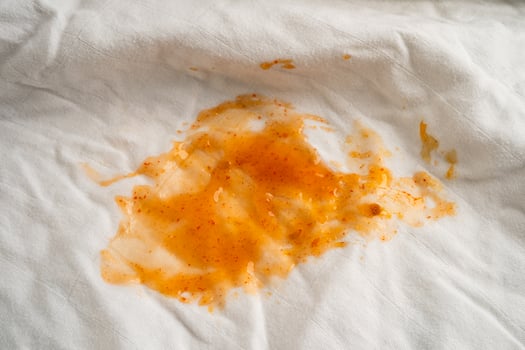 Dirty tomato sauce stain ketchup on cloth photo