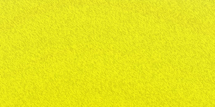 Bright yellow textured background with diagonal linear pattern photo