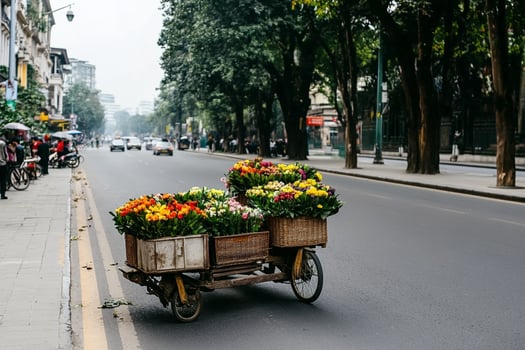 A man is riding a bicycle with a cart full of flowers photo