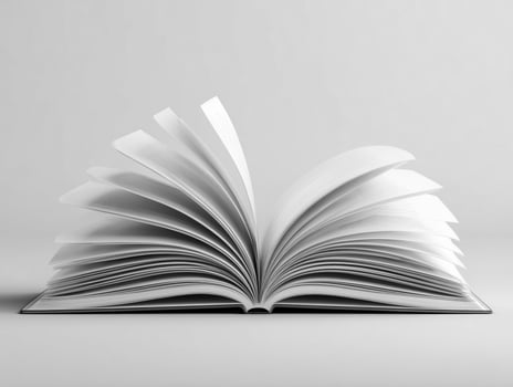 Open book with turning pages on gray background. photo