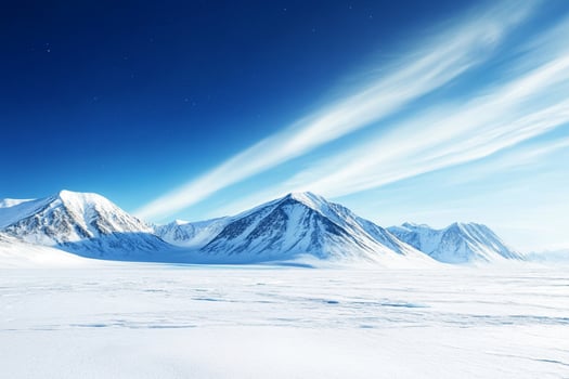 A snowy mountain landscape with a blue sky photo