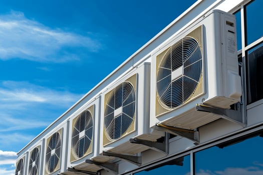 Air conditioning units on a building with blue sky photo