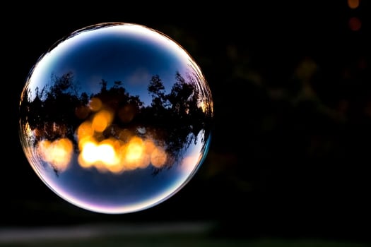 A large bubble with a reflection of the sky photo
