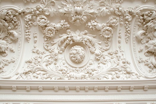 A white ceiling with ornate designs photo