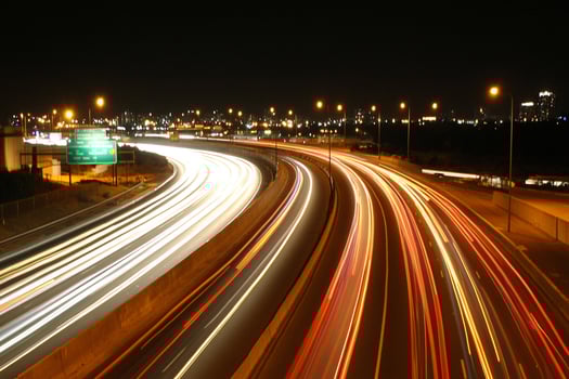 A highway with cars driving on it photo