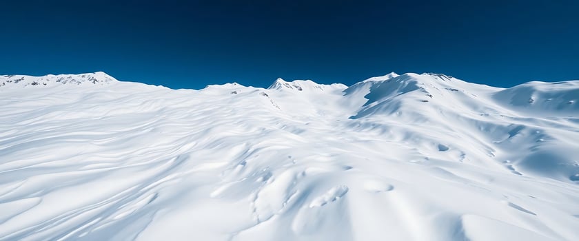mountain covered in snow under a blue sky photo
