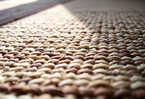 close up of a carpet with a rug in the background photo