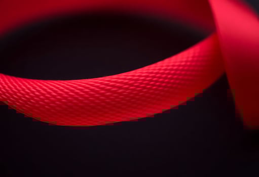 close up of a red ribbon on a black background photo