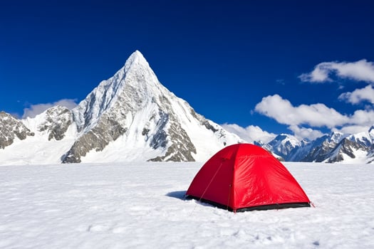 A tent is set up on top of a snowy mountain photo