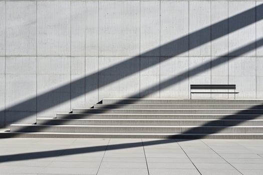A bench is sitting on the steps of a building photo