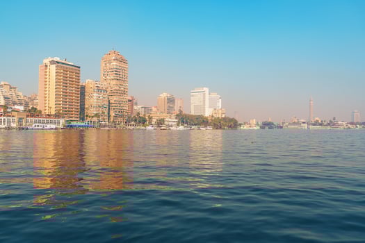 Cairo city skyline reflects on the Nile River during a clear day in the heart of Egypt photo