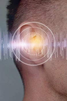 Conceptual representation of sound waves interacting with human hearing in a digital art setting photo