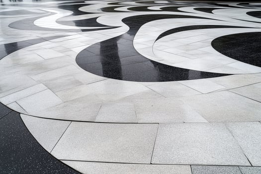 A black and white marble floor with a large black and white design photo
