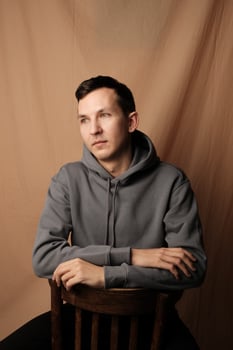 This is a Casual Portrait of a Young Man dressed in a stylish Hoodie, exuding confidence photo
