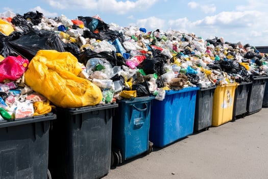 A large pile of trash in a parking lot photo