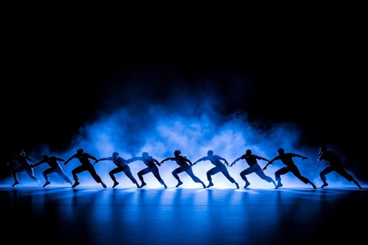 A group of dancers in blue smoke photo