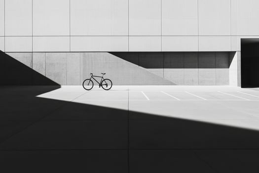 A bike is parked in front of a building photo