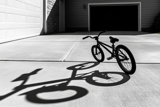 Shadow of a bicycle on the driveway photo