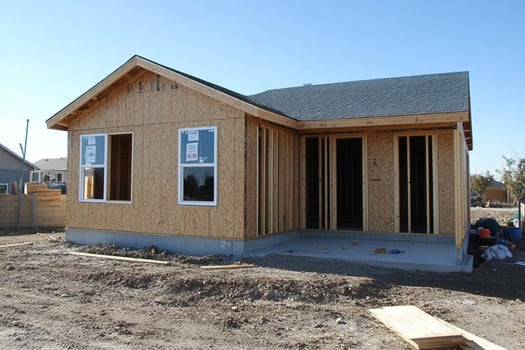 A house under construction with a wooden frame photo