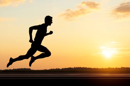 A man running in the sunset photo
