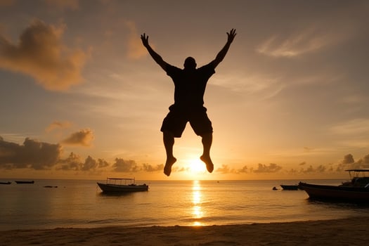 A man jumping in the air at sunset photo