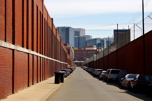 A long row of cars parked along a street photo