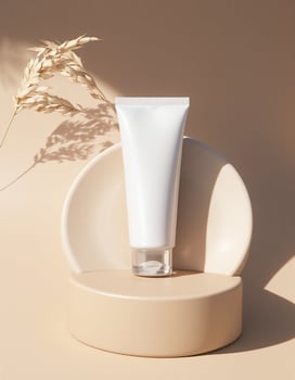 A tube of cream is sitting on a small stand photo
