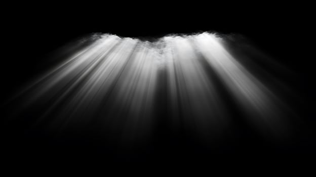 White light beams shining down from above against a dark black background creating a dramatic effect photo