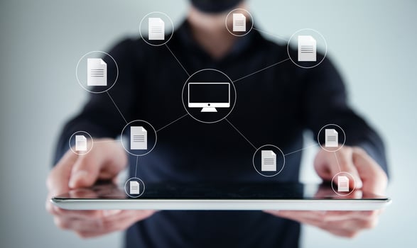 Businessman holding tablet with icons of internet connection photo
