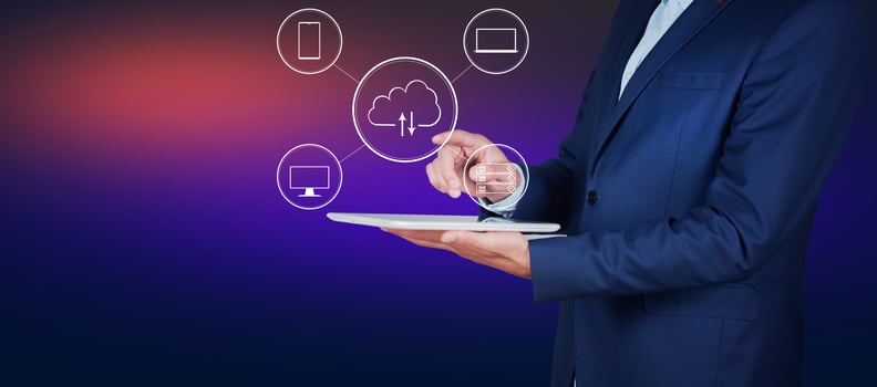 Businessman in suit holding tablet with icons photo
