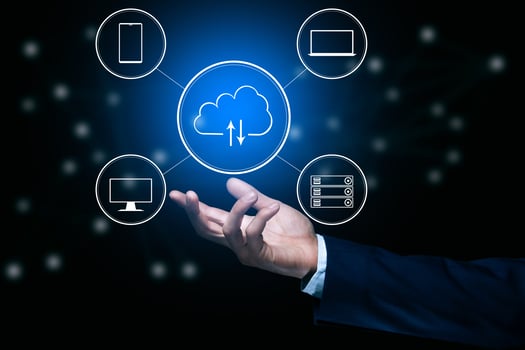 Businessman hand holding cloud computing icons on black background photo