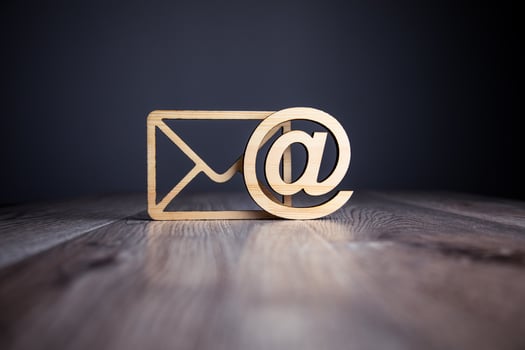 Email icon on wooden table photo
