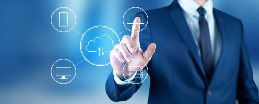 Businessman in suit touching cloud computing icons on blue background photo
