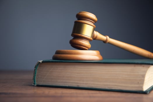 Wooden gavel on top of book photo