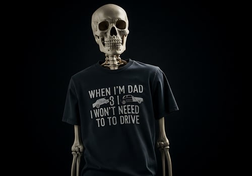 A skeleton wearing a t - shirt that says when my dad is dead i won't need to photo