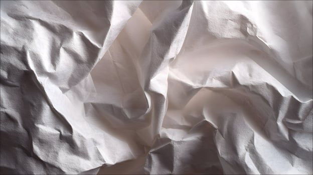 Elegant arrangement of soft white fabric folds in abstract composition conveying simplicity and purity photo