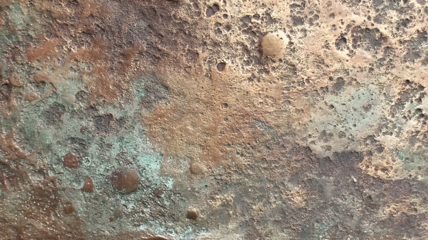 Eroded Metal Surface Detail with Copper Green and Brown Patina Offering Abstract Texture photo