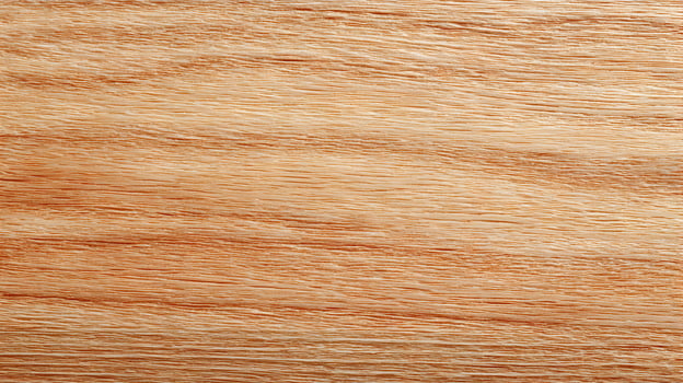 Detailed close up of natural oak wood grain shows texture and pattern in warm golden brown tones photo