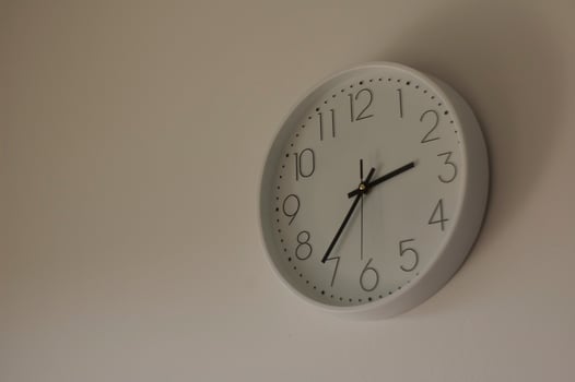 Clock in the wall in the twilight photo