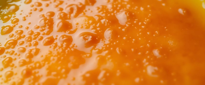 Close up of orange juice with water droplets photo