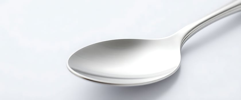 close up of a spoon on a white surface photo