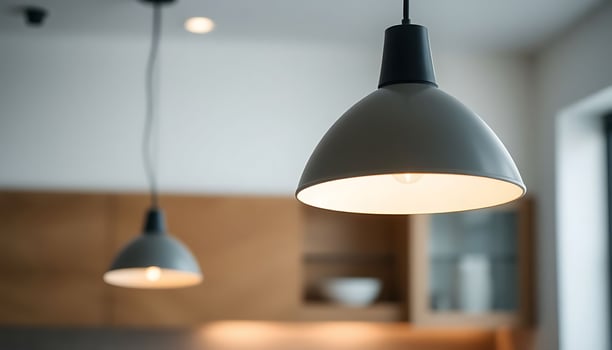 couple of lights hanging from a ceiling photo